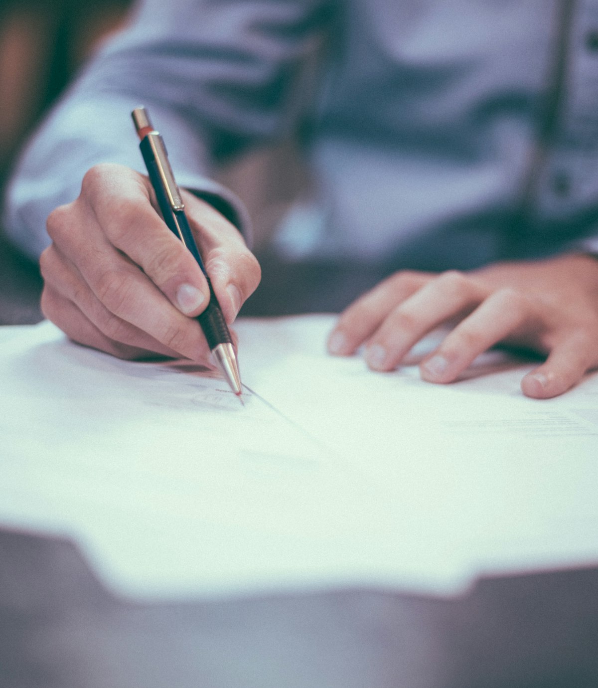 A partner signing a client file